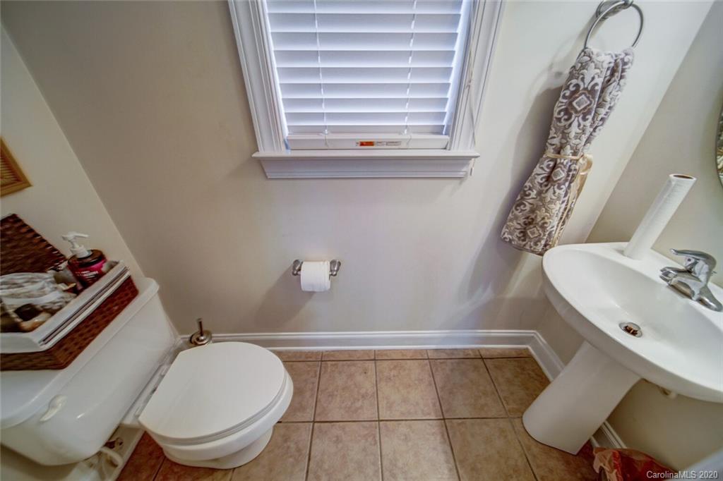 9510 Ridgeforest Drive Charlotte, NC 28277 - Photo 23 of 46 a bathroom with a sink toilet and mirror