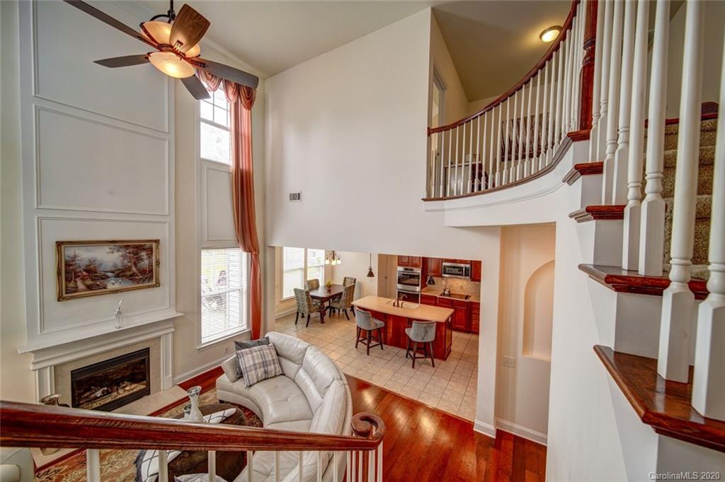 9510 Ridgeforest Drive Charlotte, NC 28277 - Photo 24 of 46 a view of a livingroom with furniture hardwood floor and a fireplace