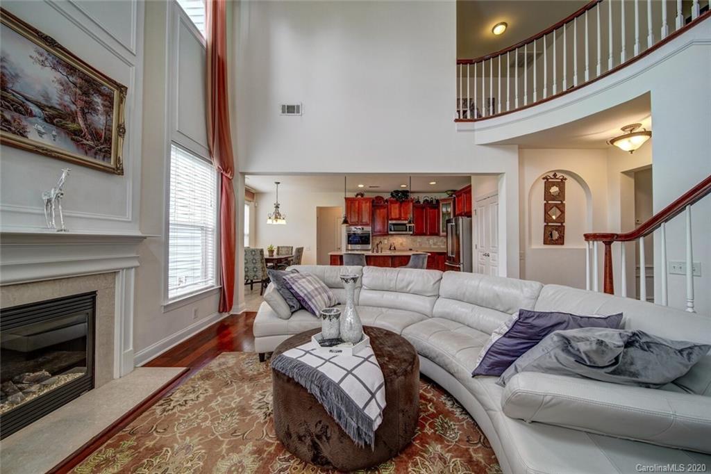 9510 Ridgeforest Drive Charlotte, NC 28277 - Photo 25 of 46 a living room with furniture and a fireplace