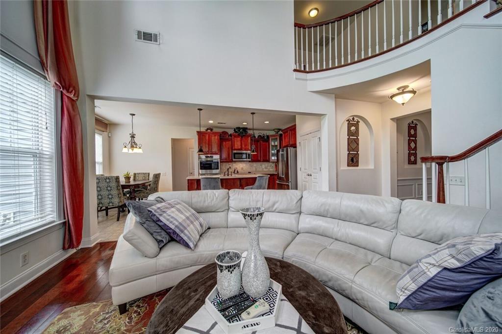 9510 Ridgeforest Drive Charlotte, NC 28277 - Photo 26 of 46 a living room with furniture and a ceiling fan