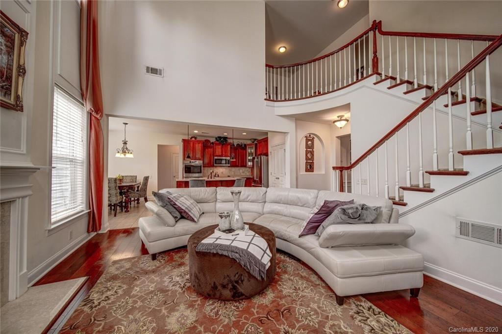 9510 Ridgeforest Drive Charlotte, NC 28277 - Photo 28 of 46 a living room with furniture or stairs and a wooden floor