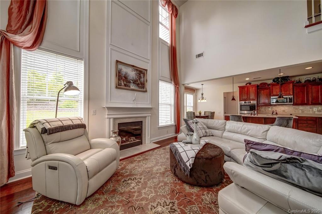 9510 Ridgeforest Drive Charlotte, NC 28277 - Photo 29 of 46 a living room with furniture fireplace and a window