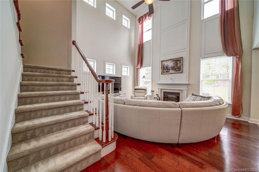 9510 Ridgeforest Drive Charlotte, NC 28277 - Photo 31 of 46 a living room with furniture and a fireplace