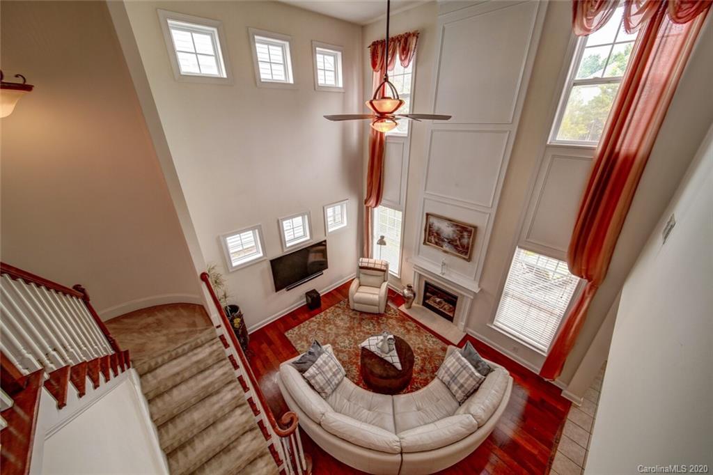 9510 Ridgeforest Drive Charlotte, NC 28277 - Photo 32 of 46 a living room with furniture and a fireplace