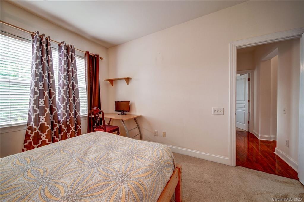 9510 Ridgeforest Drive Charlotte, NC 28277 - Photo 37 of 46 a bedroom with a bed and a window