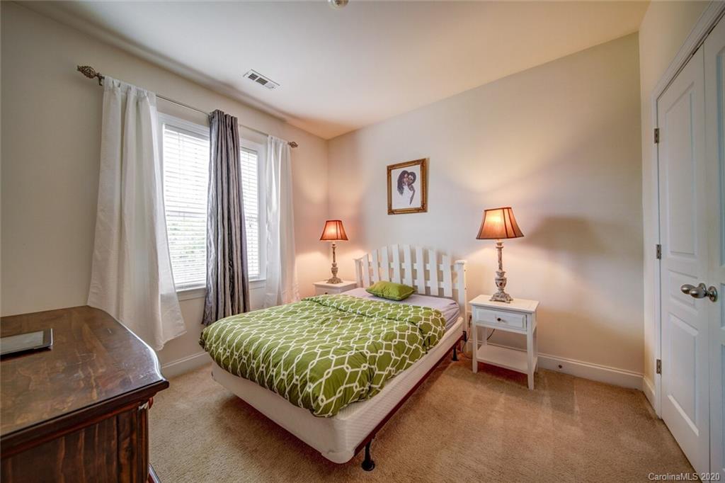 9510 Ridgeforest Drive Charlotte, NC 28277 - Photo 39 of 46 a bedroom with a bed and a table in it