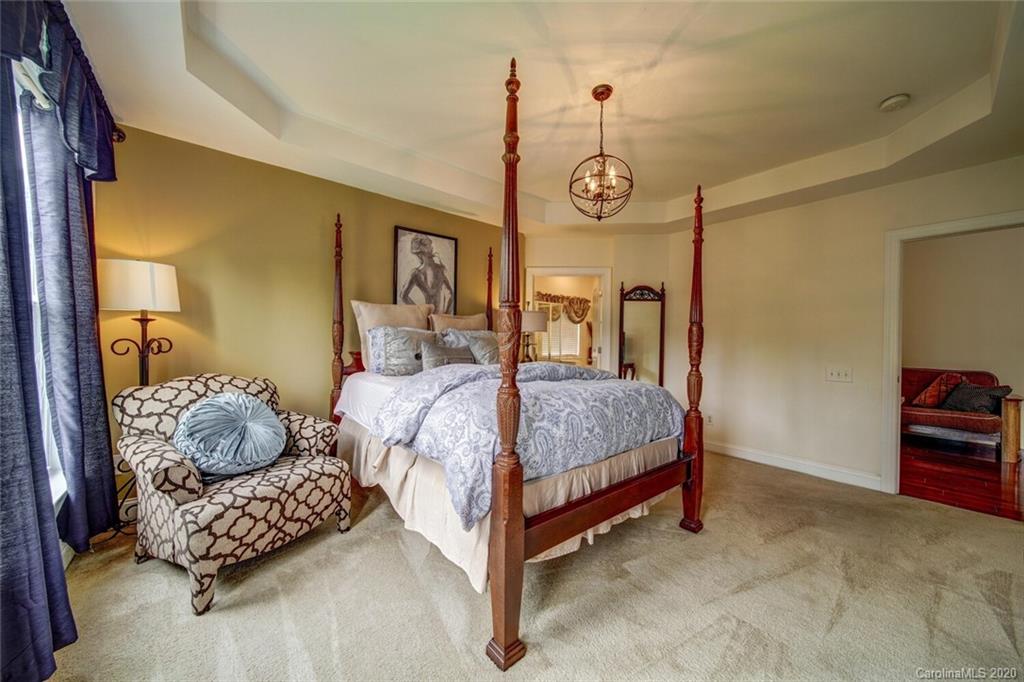 9510 Ridgeforest Drive Charlotte, NC 28277 - Photo 40 of 46 a bedroom with a bed window and a table