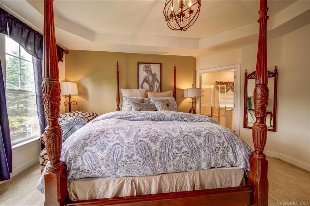 9510 Ridgeforest Drive Charlotte, NC 28277 - Photo 42 of 46 a bedroom with a large bed and a large window