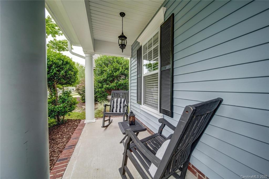 9510 Ridgeforest Drive Charlotte, NC 28277 - Photo 6 of 46 a view of balcony with wooden floor and outdoor seating