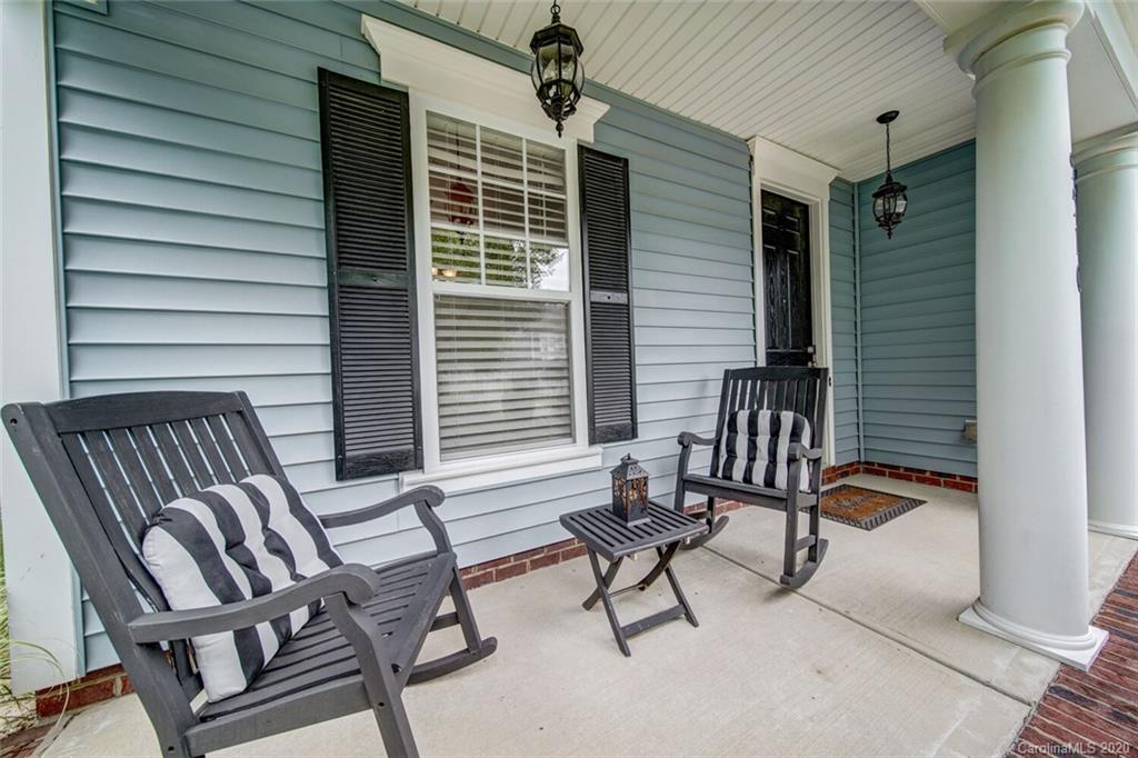 9510 Ridgeforest Drive Charlotte, NC 28277 - Photo 7 of 46 a balcony with chairs and a potted plant