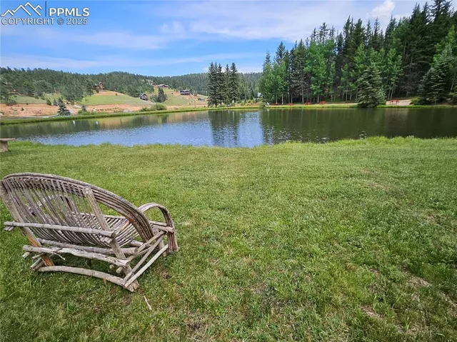 a view of a lake with a house in the background