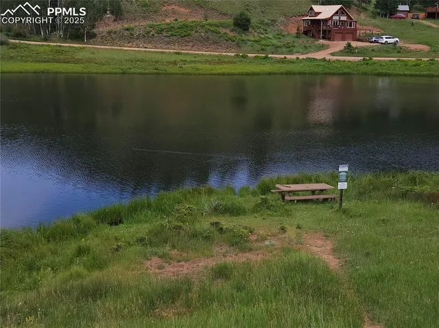 a view of a lake with a yard