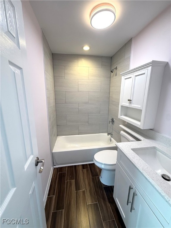 34 Hamlin Court Lehigh Acres, FL 33936 - Photo 4 of 11 a bathroom with a sink a toilet and tub