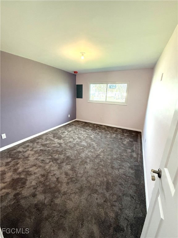 34 Hamlin Court Lehigh Acres, FL 33936 - Photo 6 of 11 an empty room with windows