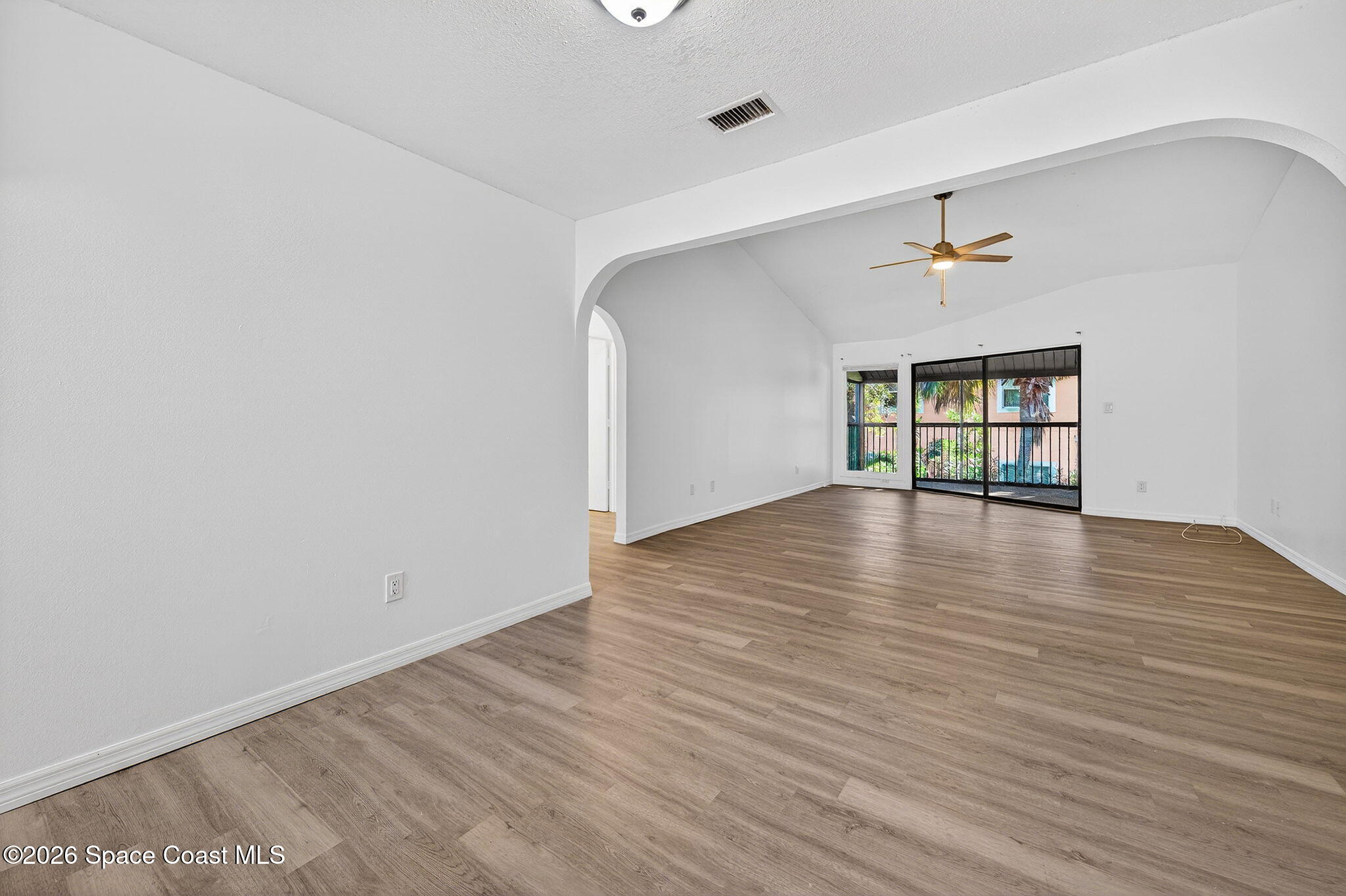 2107 Hidden Grove Lane, Unit 32B Merritt Island, FL 32953 - Photo 22 of 47 Dining Area Looking Into Family Room