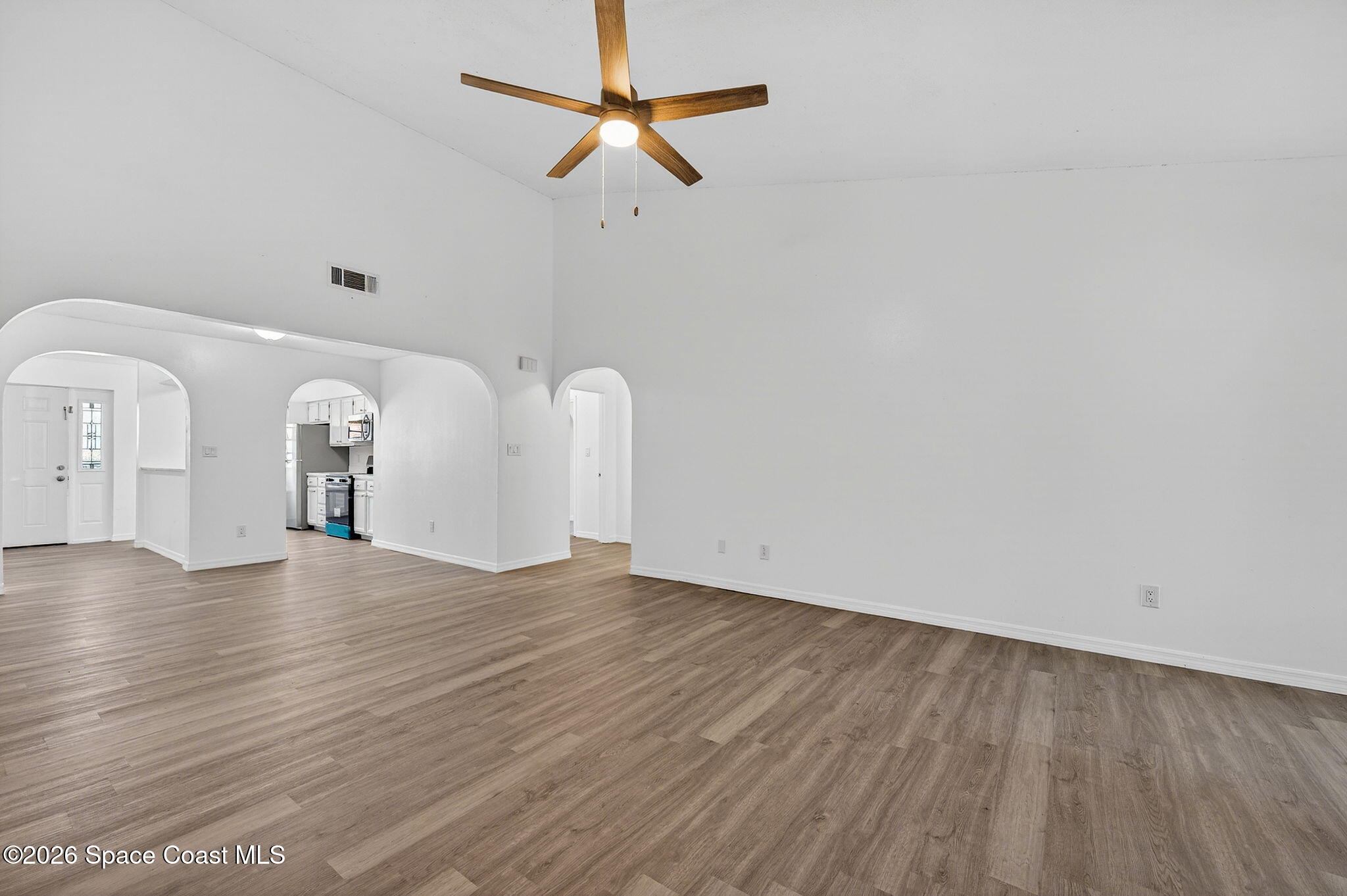 2107 Hidden Grove Lane, Unit 32B Merritt Island, FL 32953 - Photo 26 of 47 Family Room with Soaring Ceilings