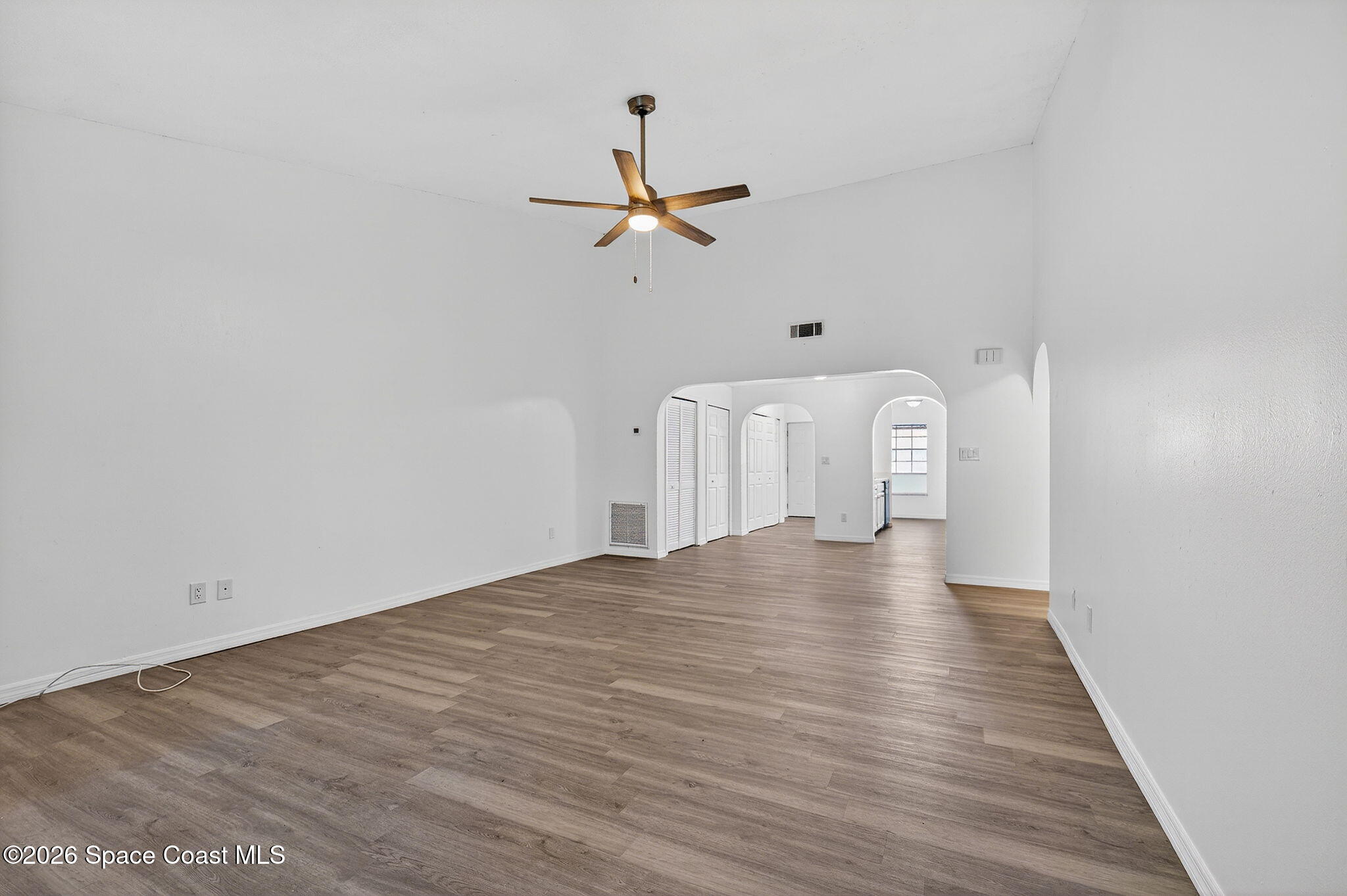 2107 Hidden Grove Lane, Unit 32B Merritt Island, FL 32953 - Photo 28 of 47 Family Room with Soaring Ceilings