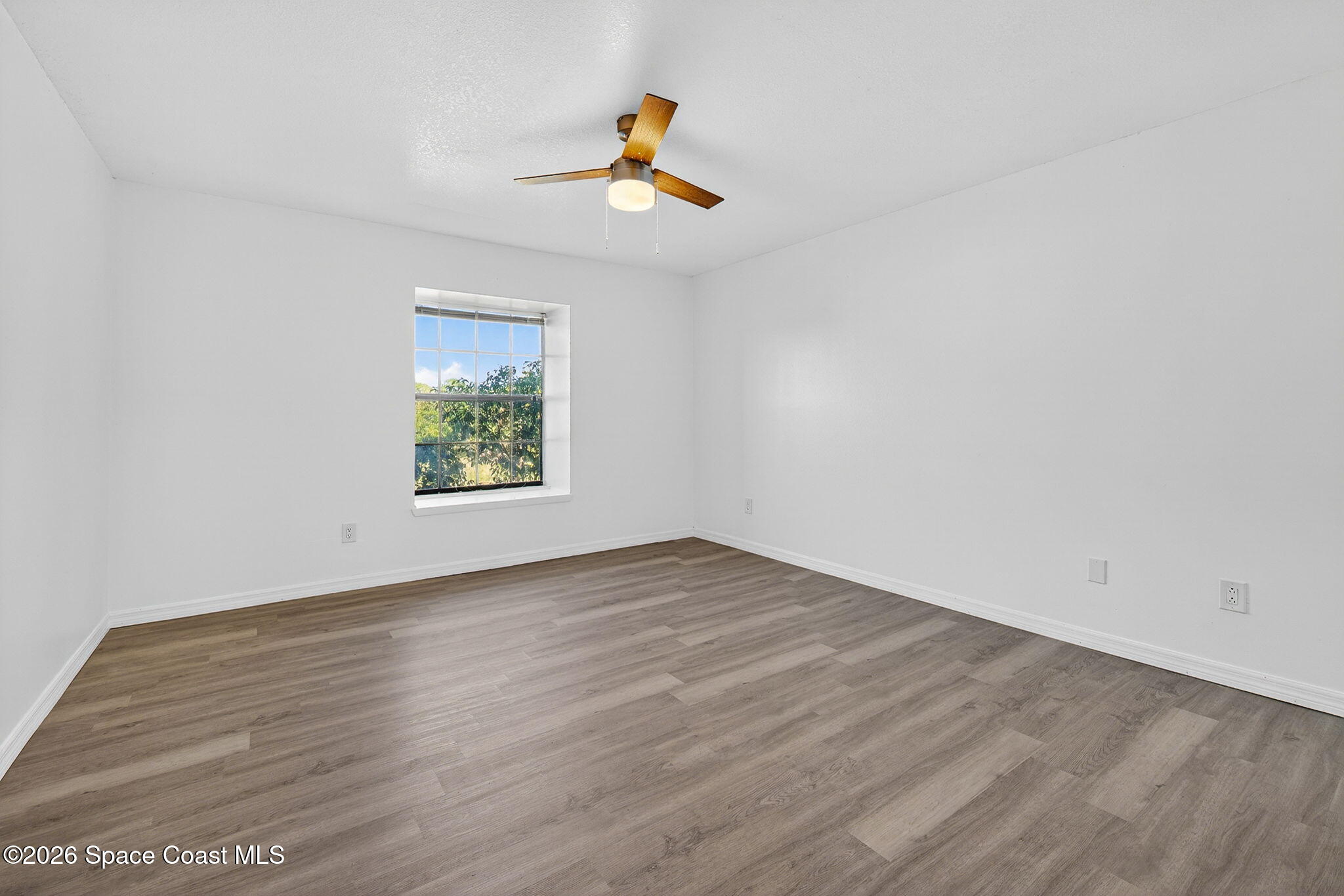 2107 Hidden Grove Lane, Unit 32B Merritt Island, FL 32953 - Photo 37 of 47 Light and Bright Master Bedroom