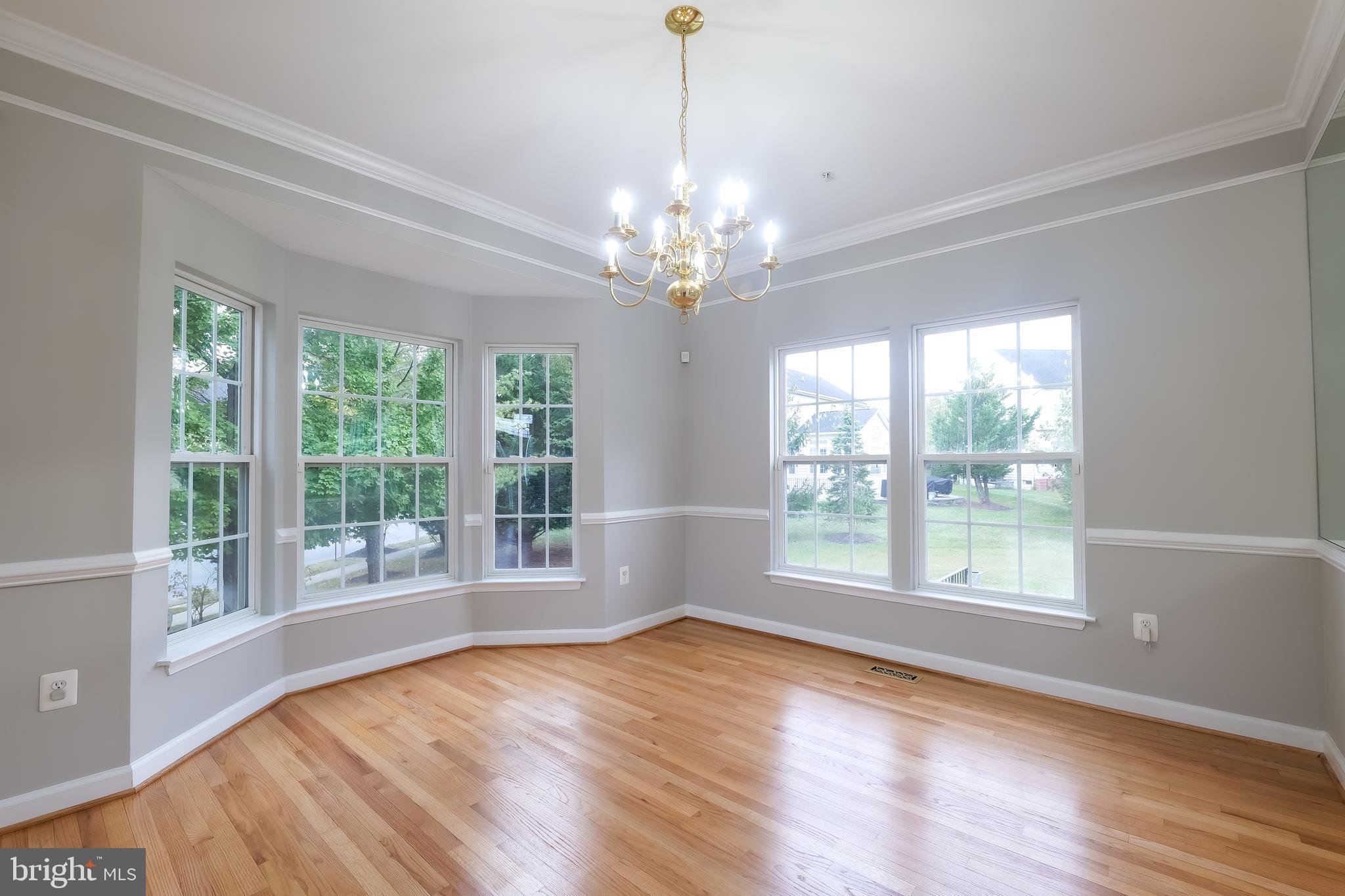 7709 Killbarron Drive Laurel, MD 20707 - Photo 56 of 79 a view of an empty room with wooden floor and a window