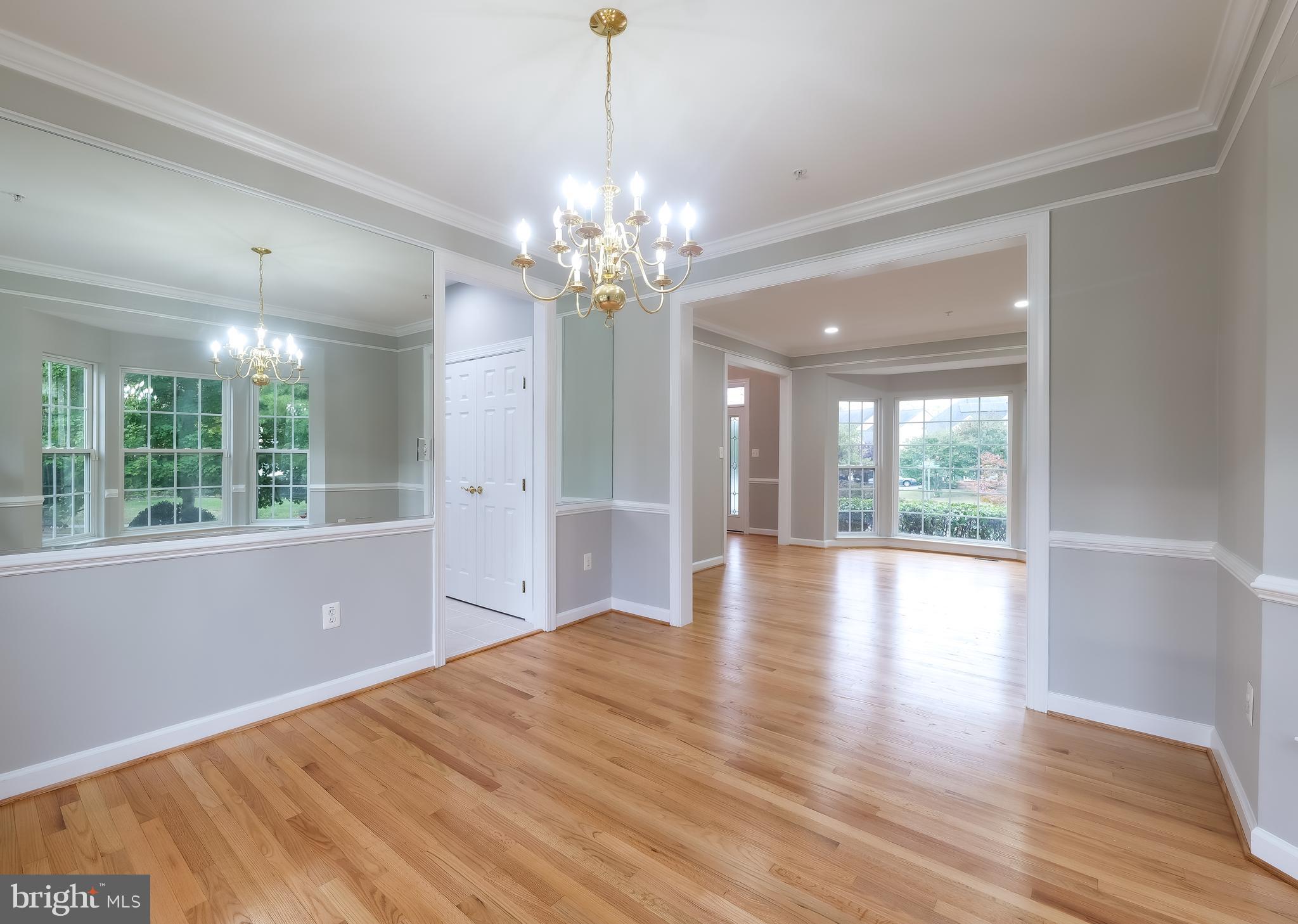 7709 Killbarron Drive Laurel, MD 20707 - Photo 58 of 79 a view of an empty room with wooden floor and a window