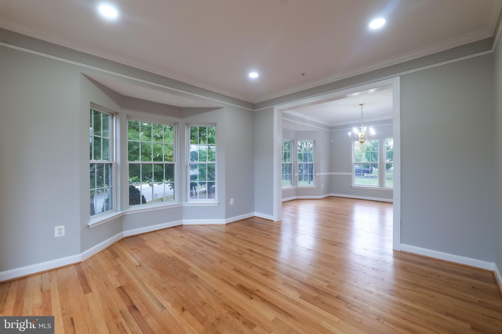 7709 Killbarron Drive Laurel, MD 20707 - Photo 60 of 79 a view of an empty room with wooden floor and a window