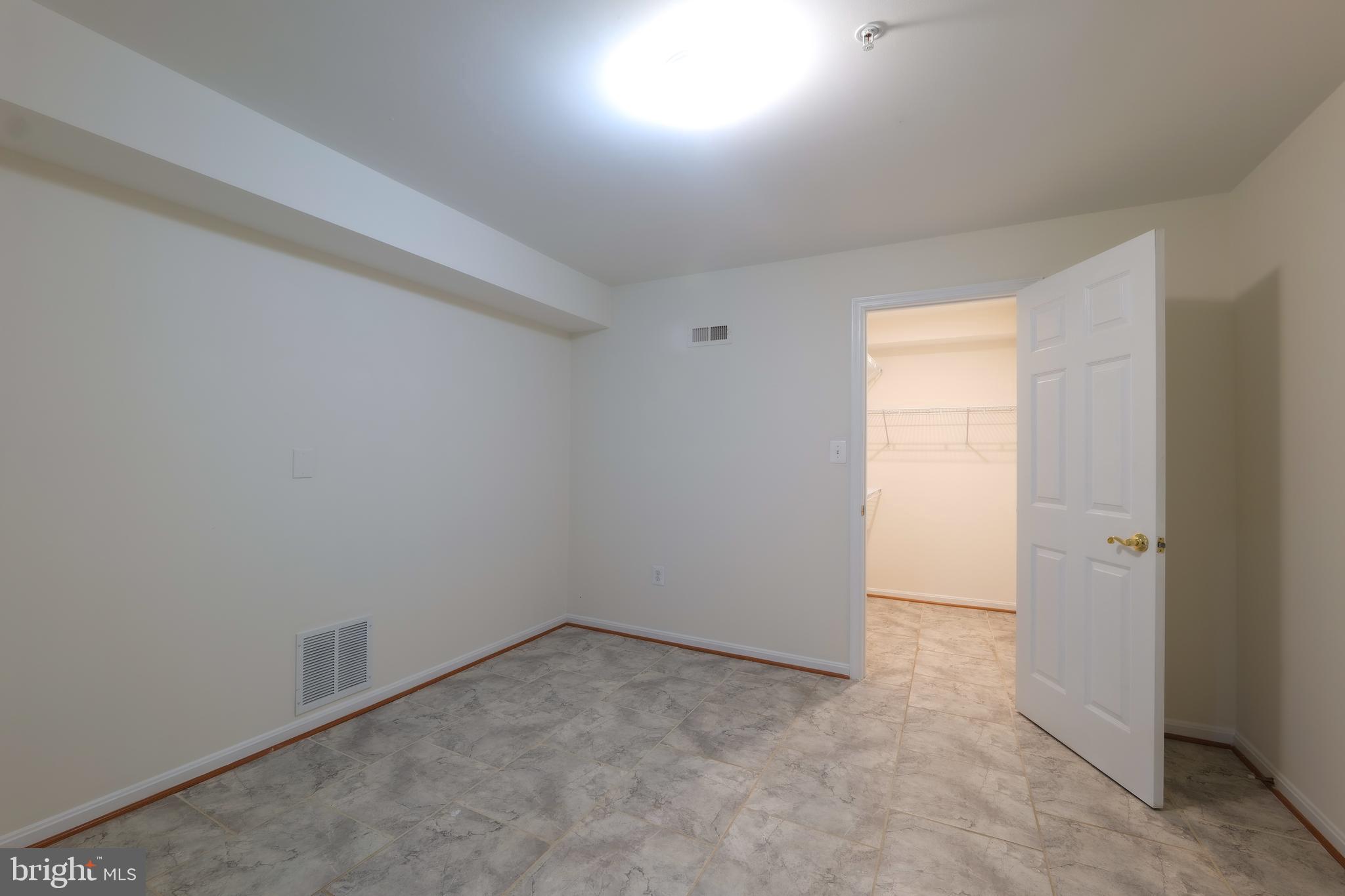 7709 Killbarron Drive Laurel, MD 20707 - Photo 62 of 79 an empty room with a empty space and windows