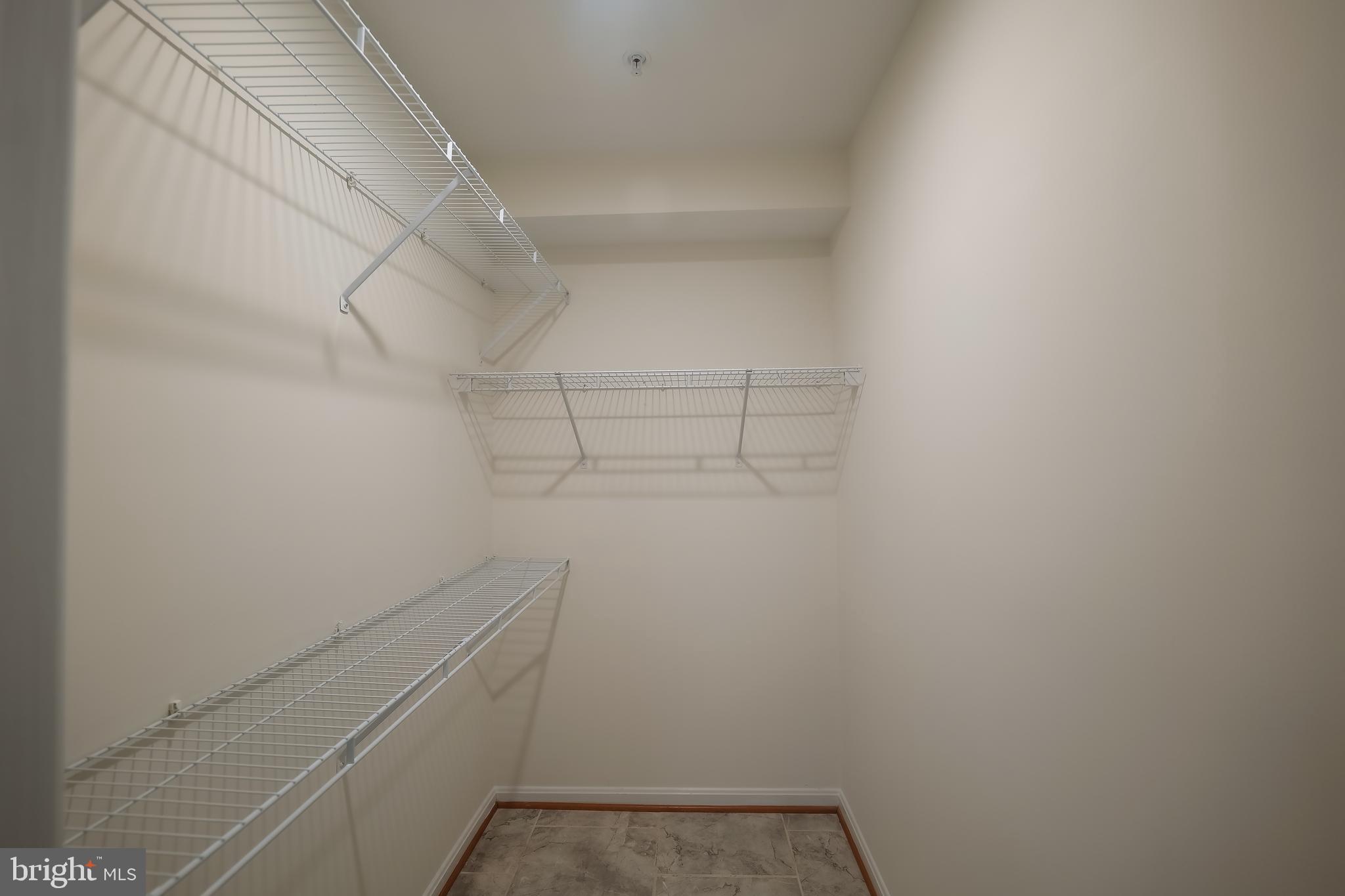 7709 Killbarron Drive Laurel, MD 20707 - Photo 64 of 79 a view of storage and utility room with racks on the wall
