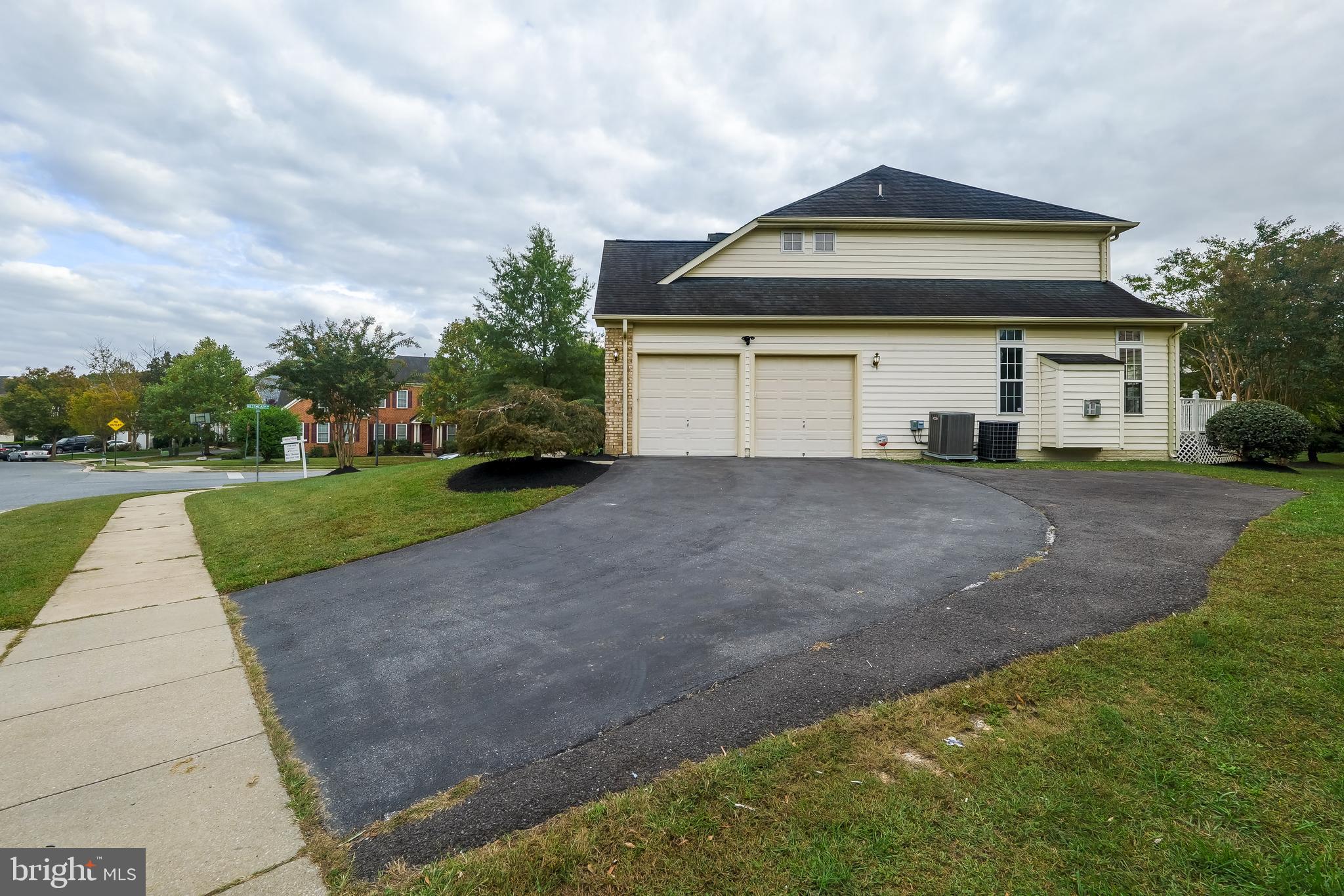 7709 Killbarron Drive Laurel, MD 20707 - Photo 7 of 79 a front view of a house with a yard and garage