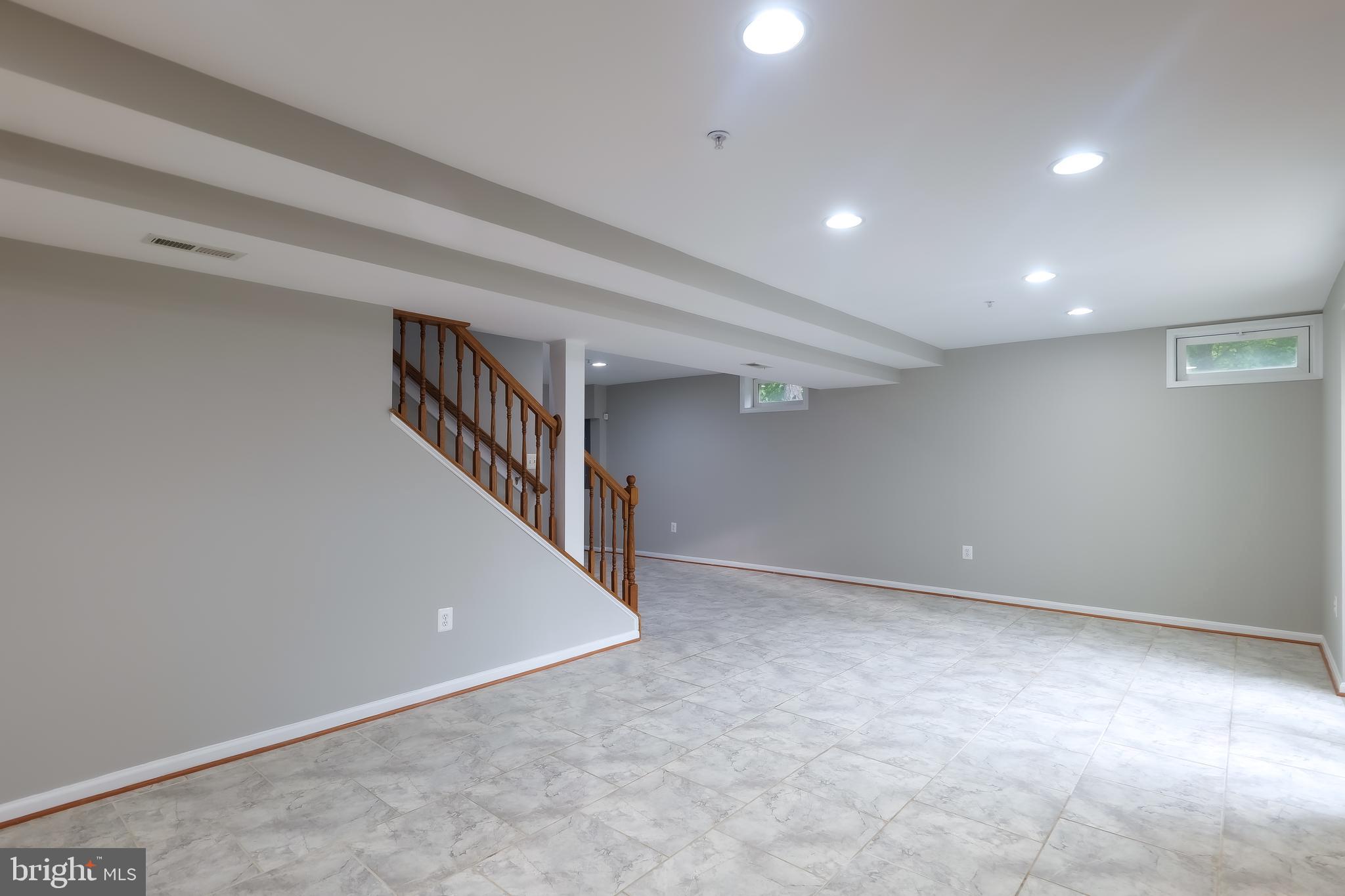 7709 Killbarron Drive Laurel, MD 20707 - Photo 72 of 79 a view of an empty room with stairs