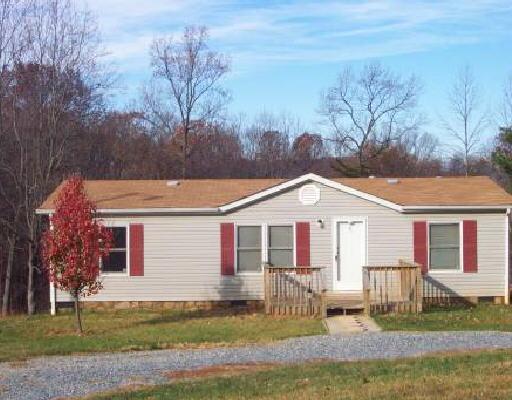 2515 Johnson School Road Thaxton, VA 24174 - Photo 1 of 1 a front view of a house with yard porch and green space