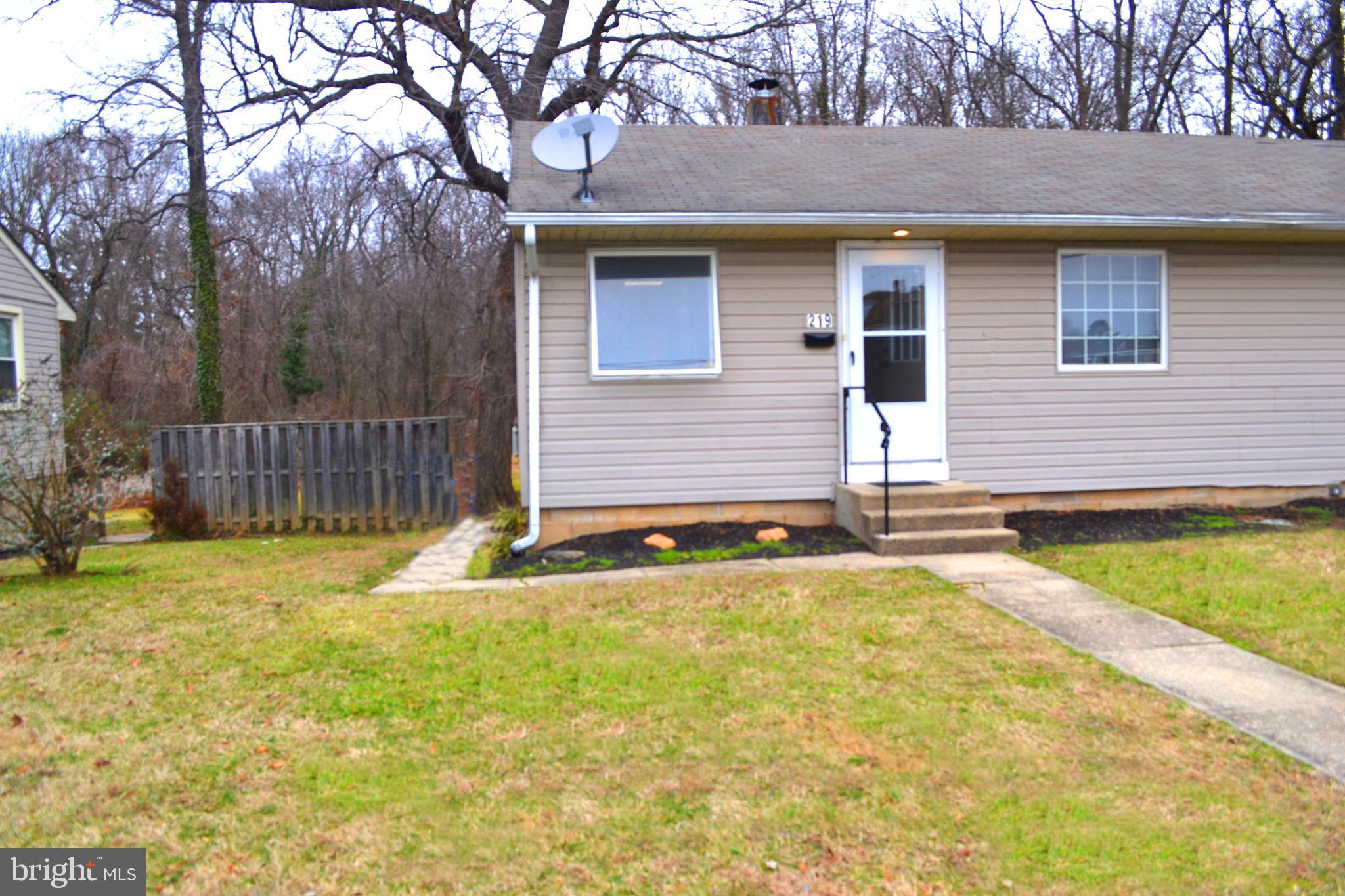 217 Walnut Alley Aberdeen, MD 21001 - Photo 1 of 13 a front view of a house with a yard