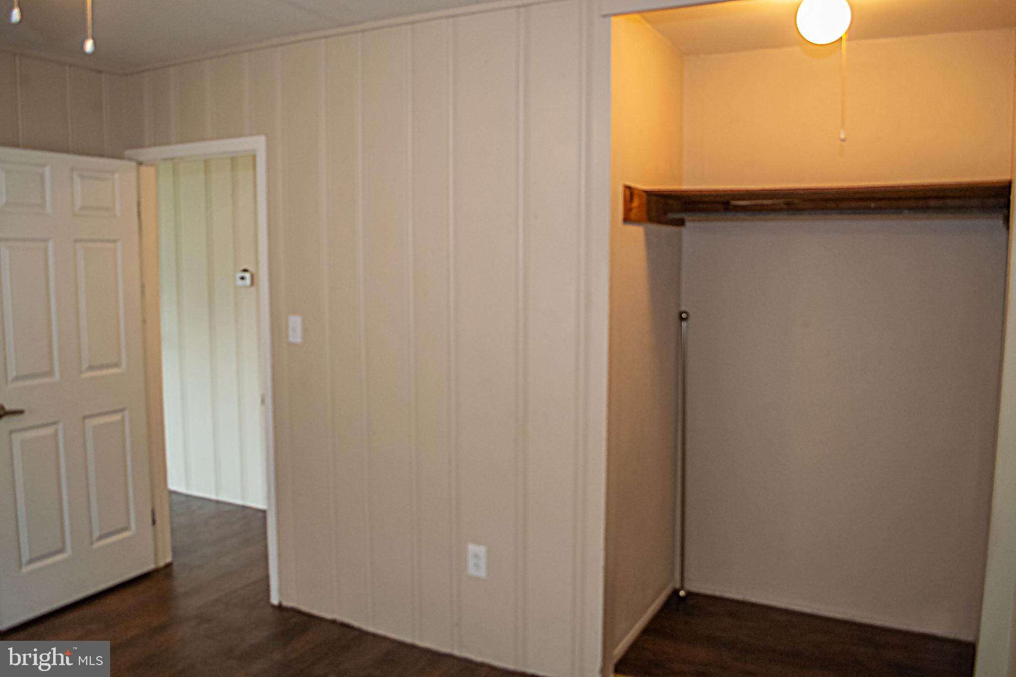 217 Walnut Alley Aberdeen, MD 21001 - Photo 3 of 13 a view of a hallway with wooden floor