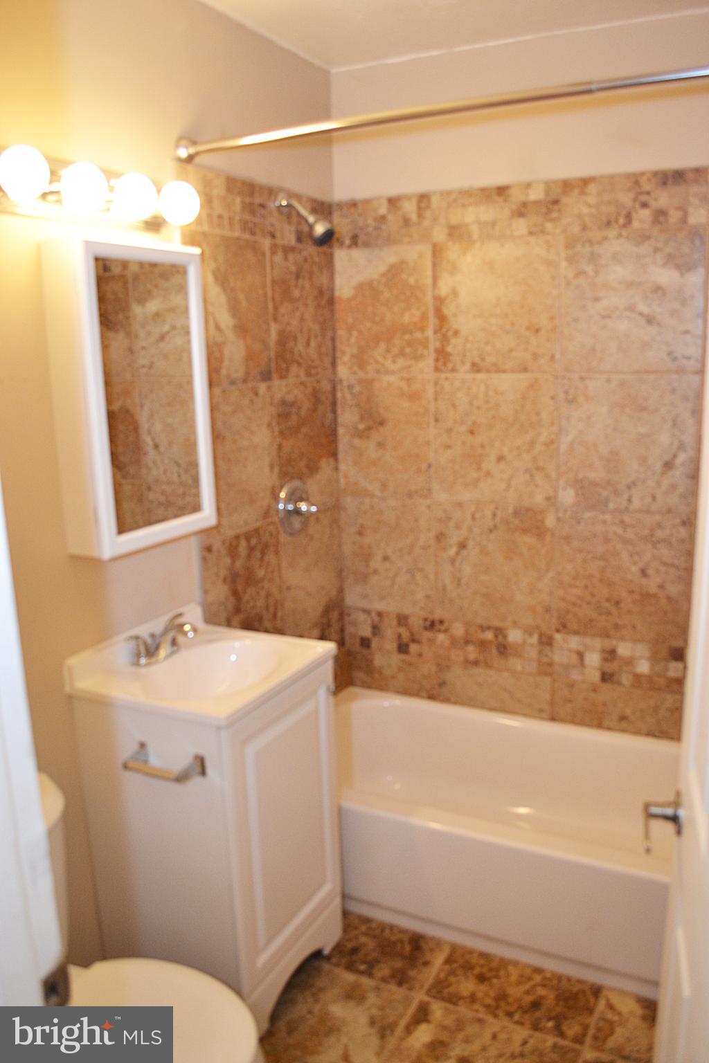 217 Walnut Alley Aberdeen, MD 21001 - Photo 6 of 13 a bathroom with a sink toilet and shower