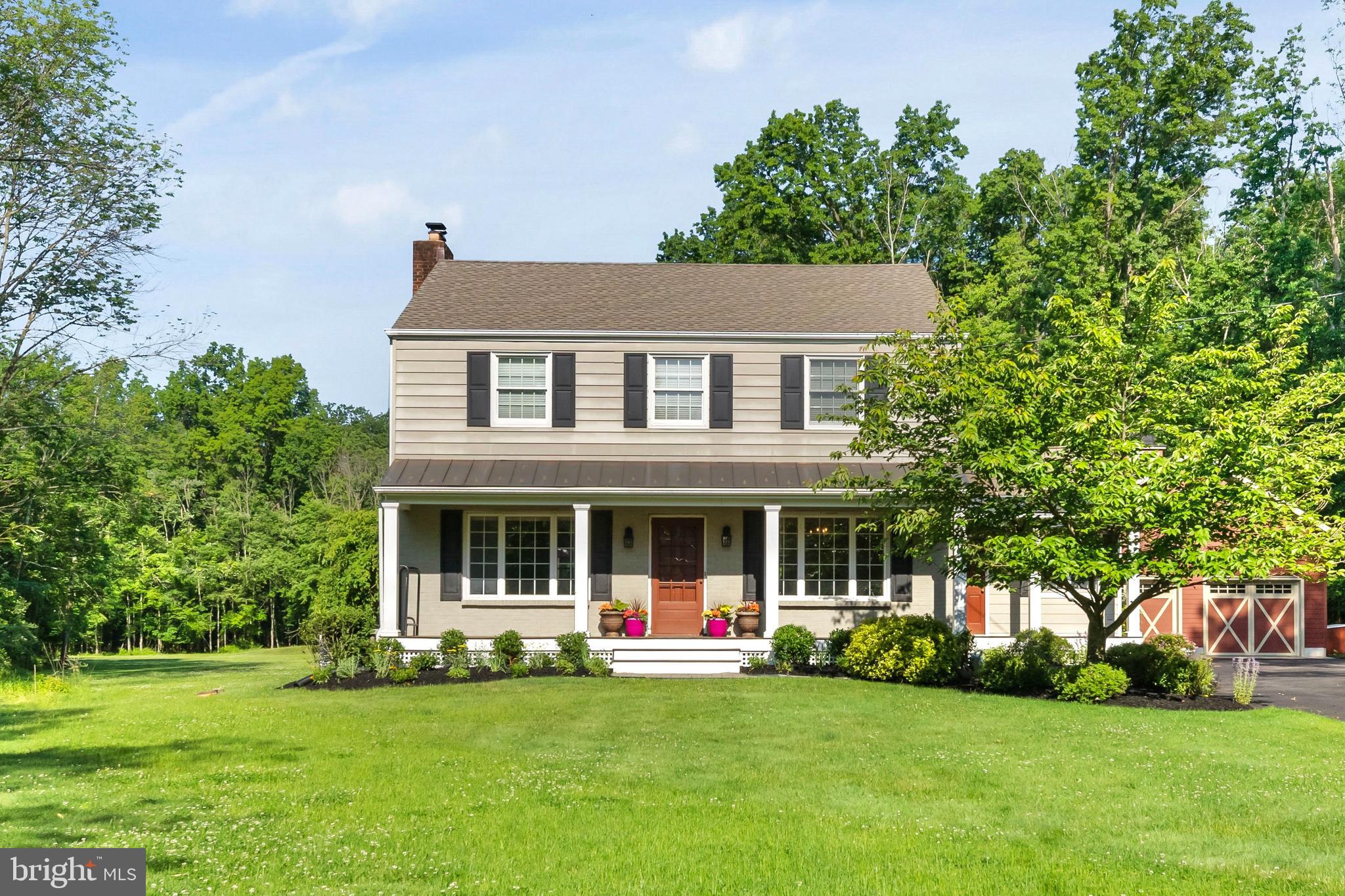 178 Lindbergh Road Hopewell, NJ 08525 - Photo 1 of 39 a front view of a house with a garden