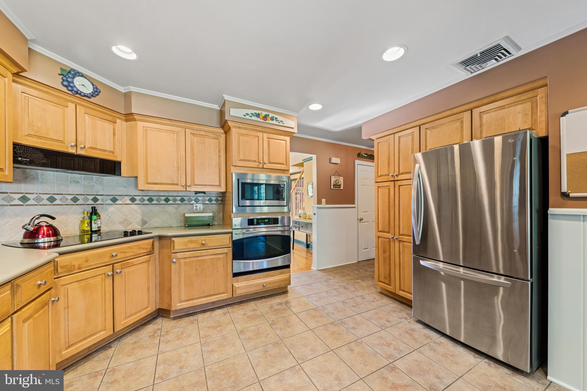 178 Lindbergh Road Hopewell, NJ 08525 - Photo 11 of 39 a kitchen with stainless steel appliances granite countertop a refrigerator and a sink