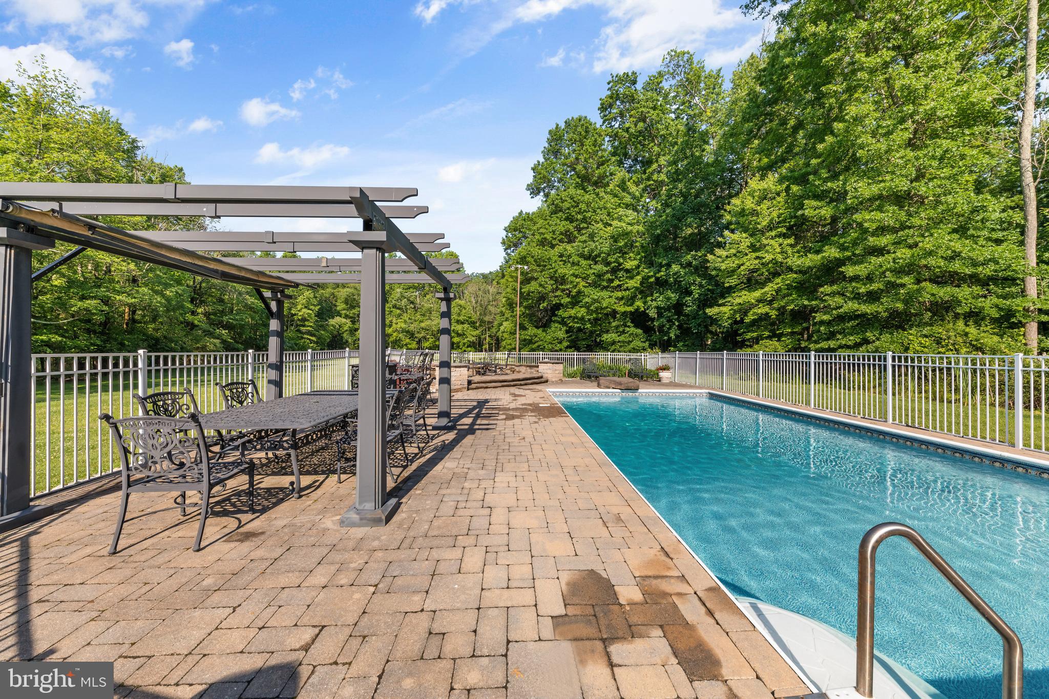 178 Lindbergh Road Hopewell, NJ 08525 - Photo 33 of 39 a view of a swimming pool with a patio