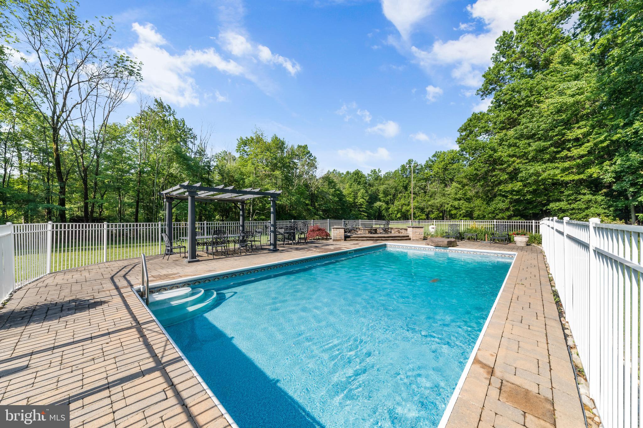 178 Lindbergh Road Hopewell, NJ 08525 - Photo 34 of 39 a view of a swimming pool with a lake view