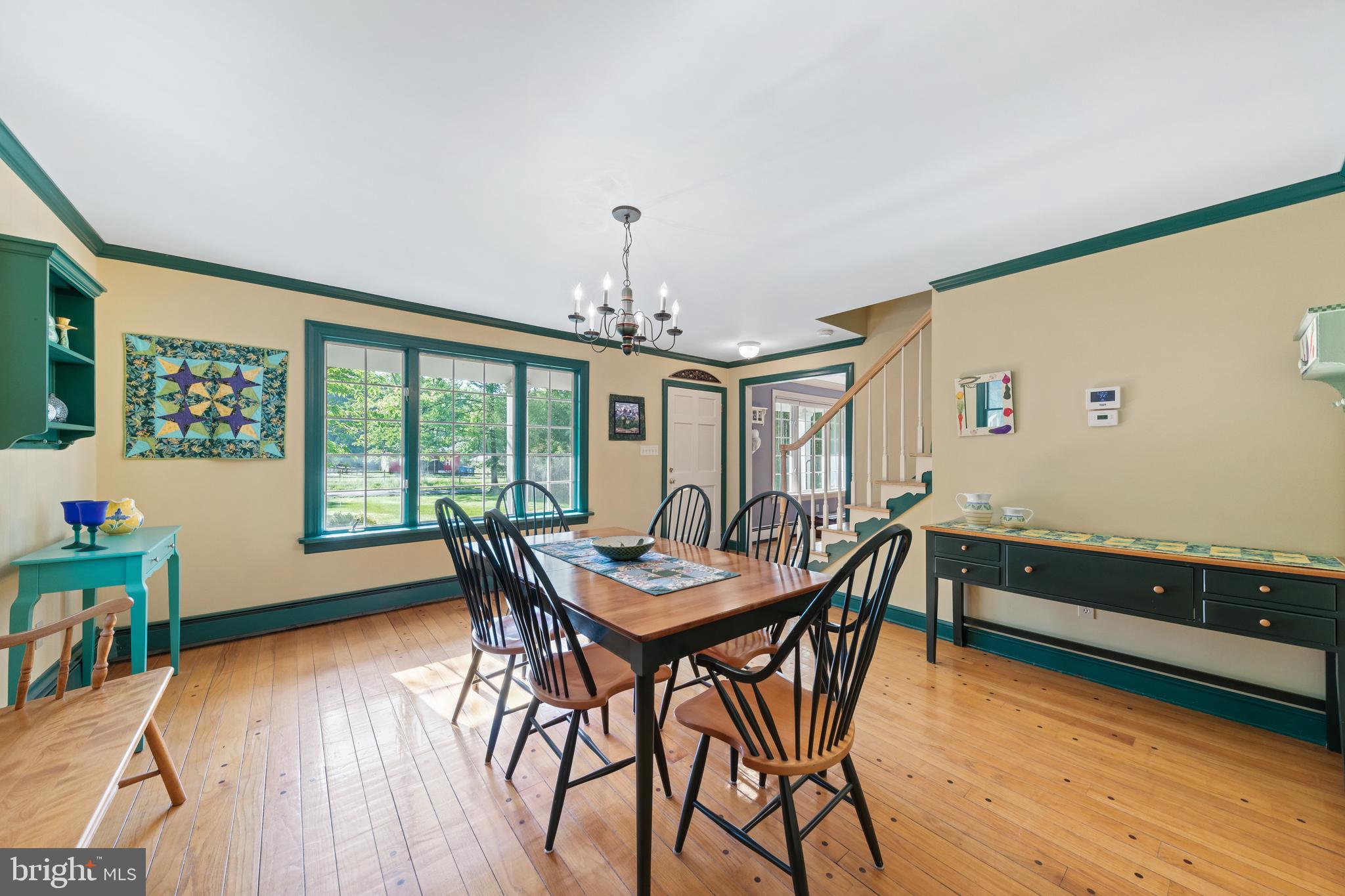 178 Lindbergh Road Hopewell, NJ 08525 - Photo 8 of 39 a view of a dining room with furniture window and wooden floor
