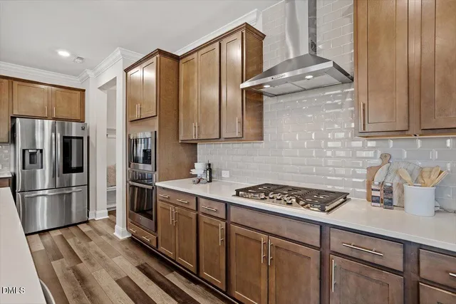 a kitchen with kitchen island granite countertop a sink appliances cabinets and counter space