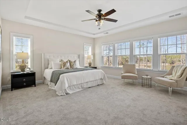 a bathroom with a double vanity sink a mirror and a shower
