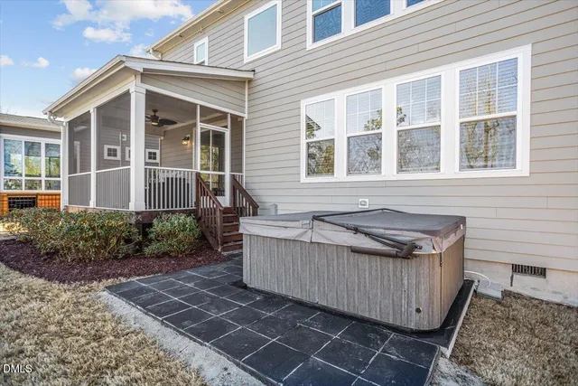 a view of a sign board with large tree