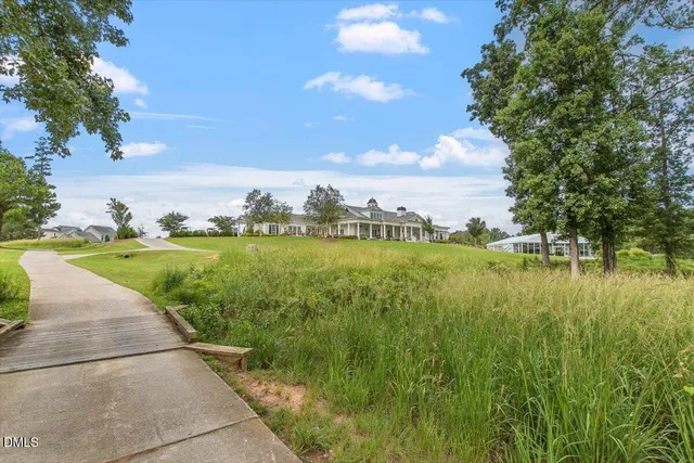 a view of a golf course with a lake
