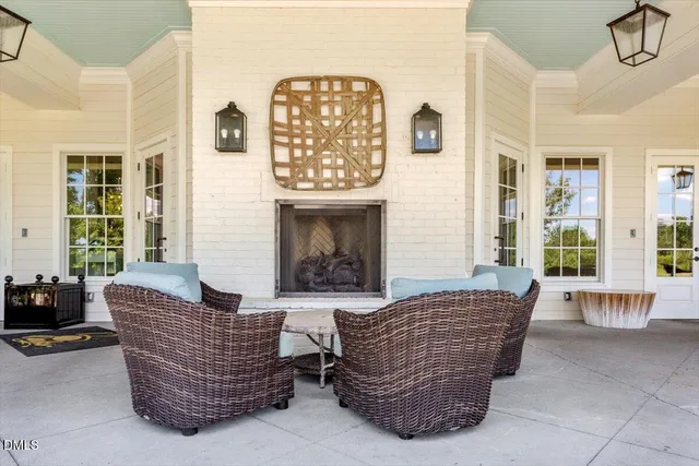 a view of a swimming pool with an outdoor seating
