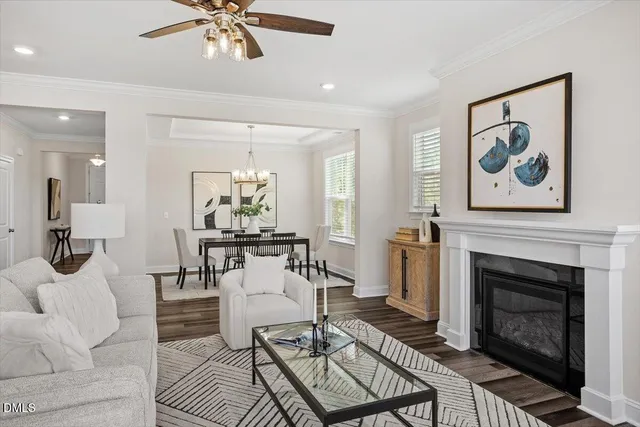 a living room with furniture and kitchen view