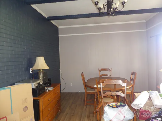 a dining room with furniture and wooden floor