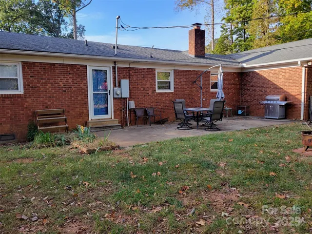 a view of a house with a yard porch and sitting area