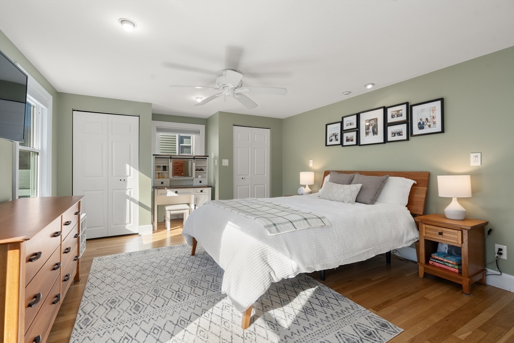 48 Spring Street Wakefield, MA 01880 - Photo 16 of 28 a spacious bedroom with a bed a dresser and potted plant on the dresser
