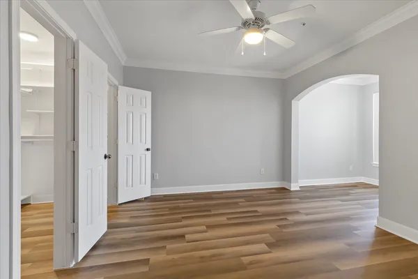 a view of an empty room and wooden floor