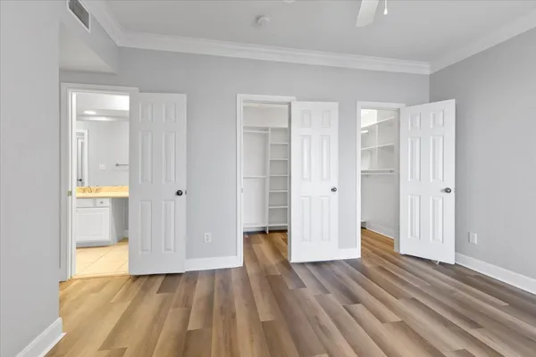a view of a room with wooden floor and bathroom