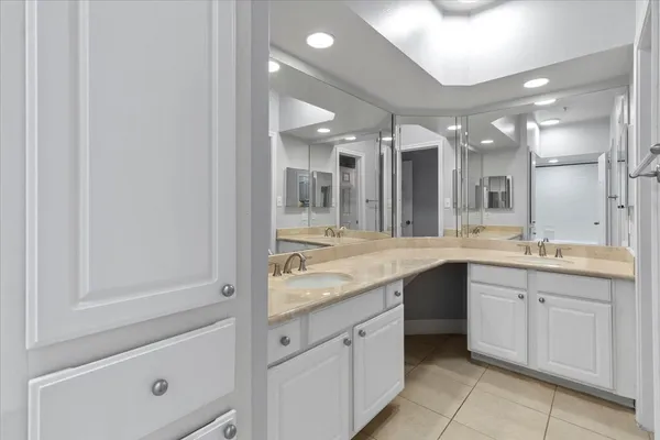 a bathroom with a granite countertop sink mirror and